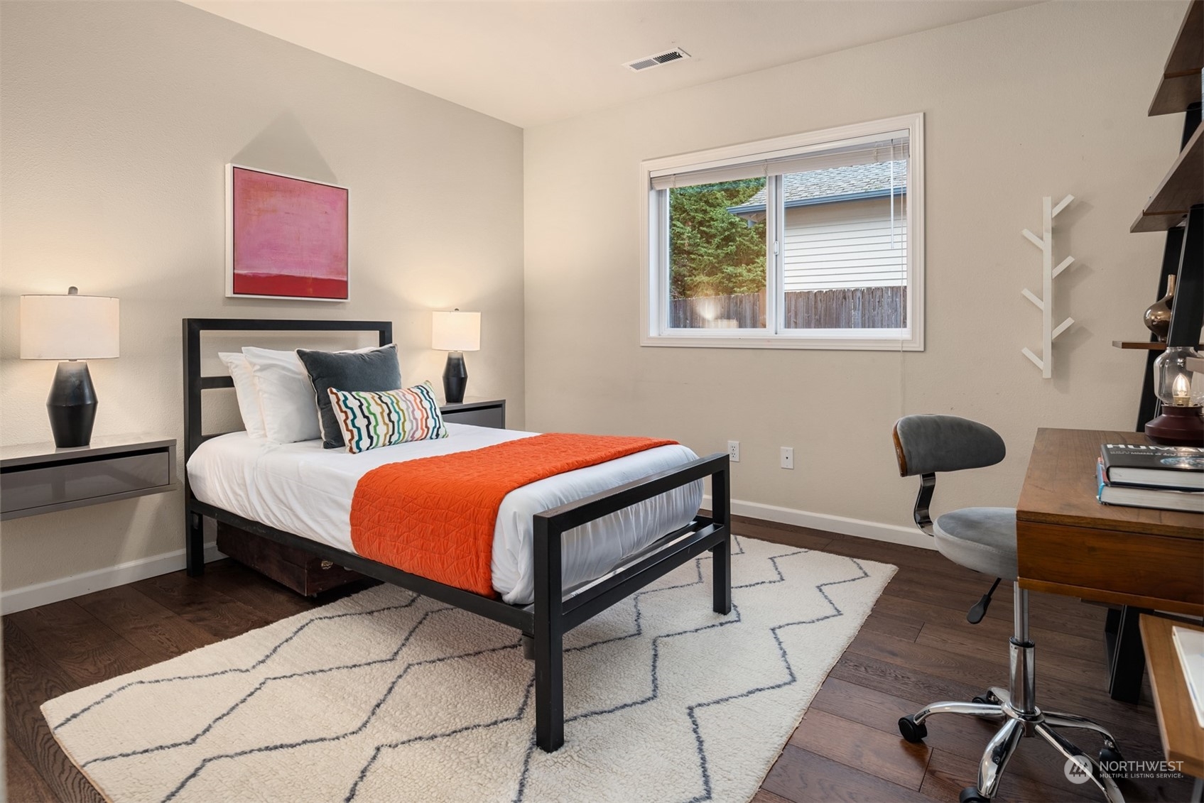 16034 68th Avenue West Edmonds, WA 98026 - Photo 23 of 32 a bedroom with a bed a desk and chair