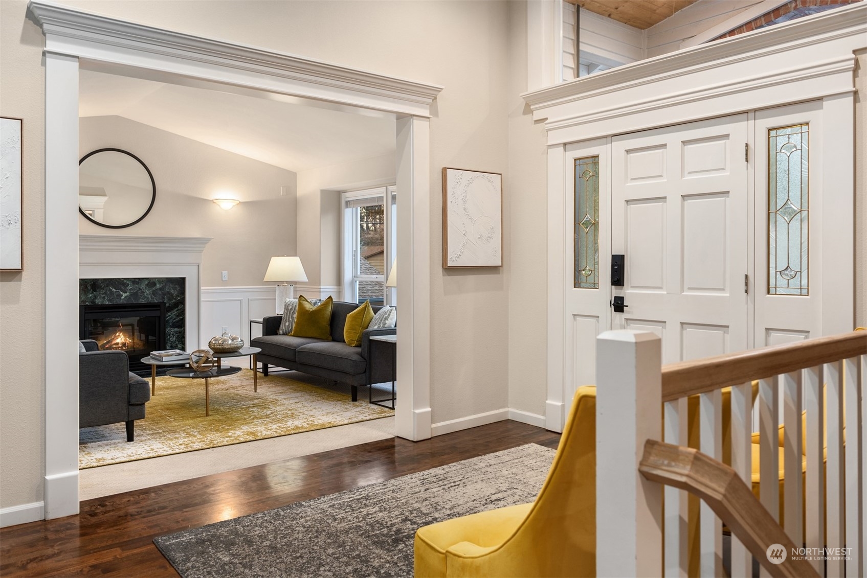 16034 68th Avenue West Edmonds, WA 98026 - Photo 31 of 32 a living room with furniture a fireplace and a table