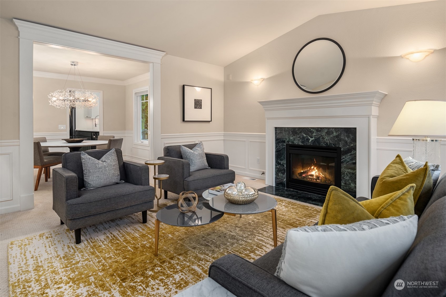 16034 68th Avenue West Edmonds, WA 98026 - Photo 6 of 32 a living room with furniture a fireplace a rug and a window