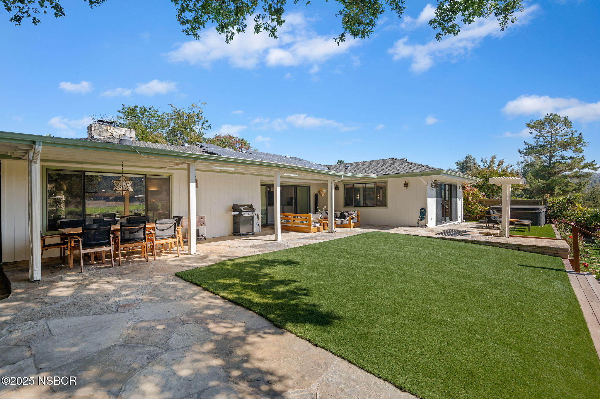 137 3rd Street Solvang, CA 93463 - Photo 26 of 48 a front view of a house with garden and porch