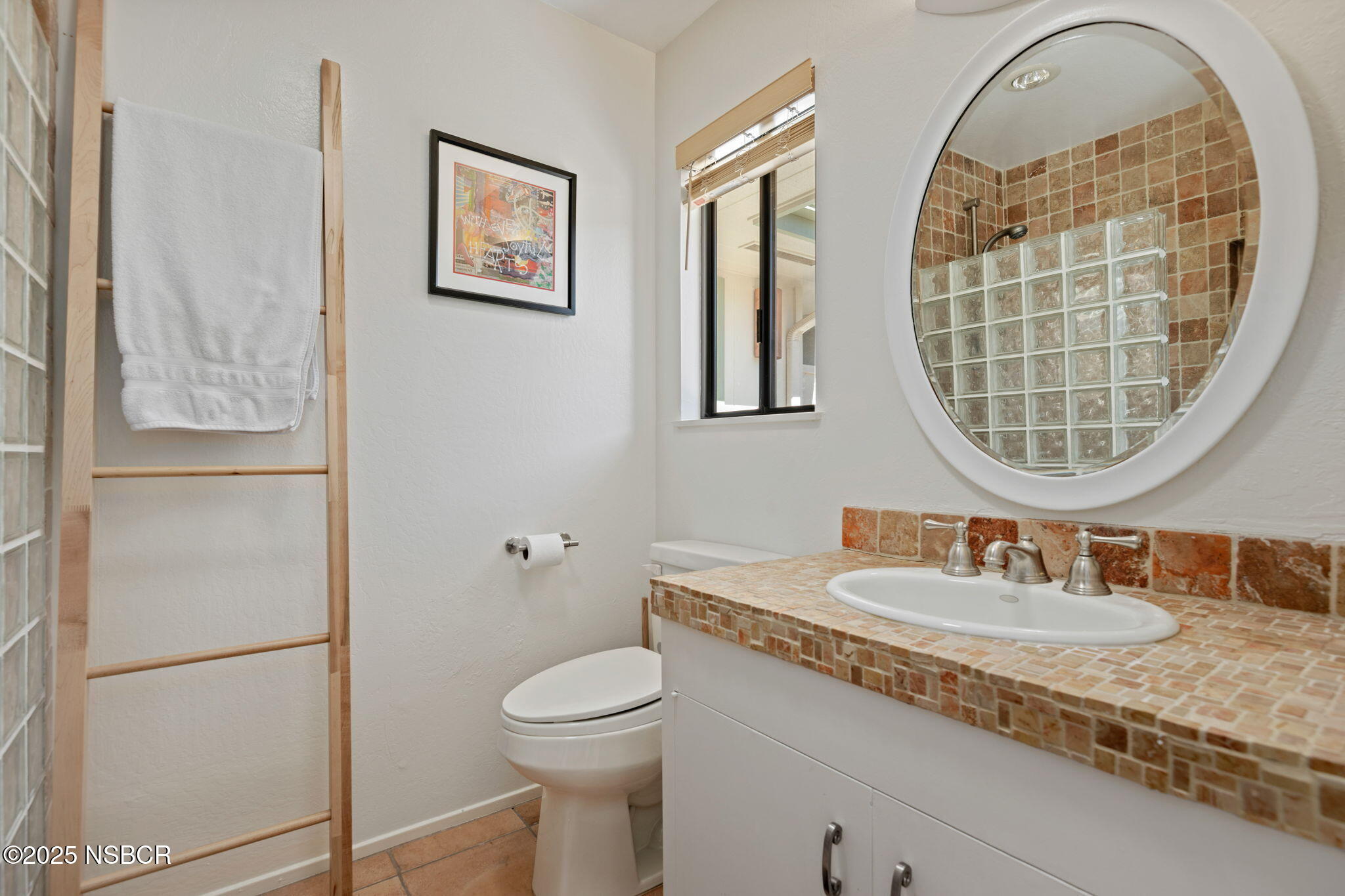 137 3rd Street Solvang, CA 93463 - Photo 37 of 48 a bathroom with a sink and a mirror