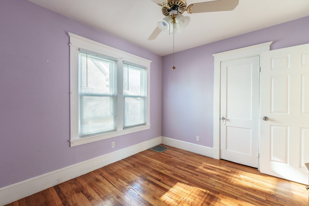 127 Webber Street Springfield, MA 01108 - Photo 11 of 33 wooden floor in an empty room with a window