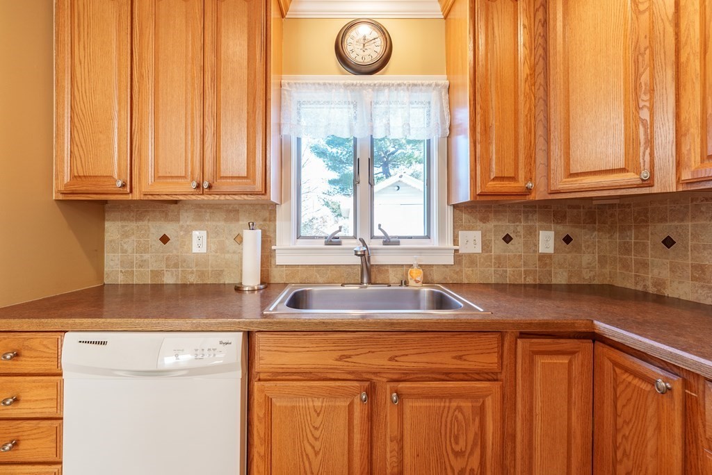 127 Webber Street Springfield, MA 01108 - Photo 16 of 33 a kitchen with granite countertop a sink and a window