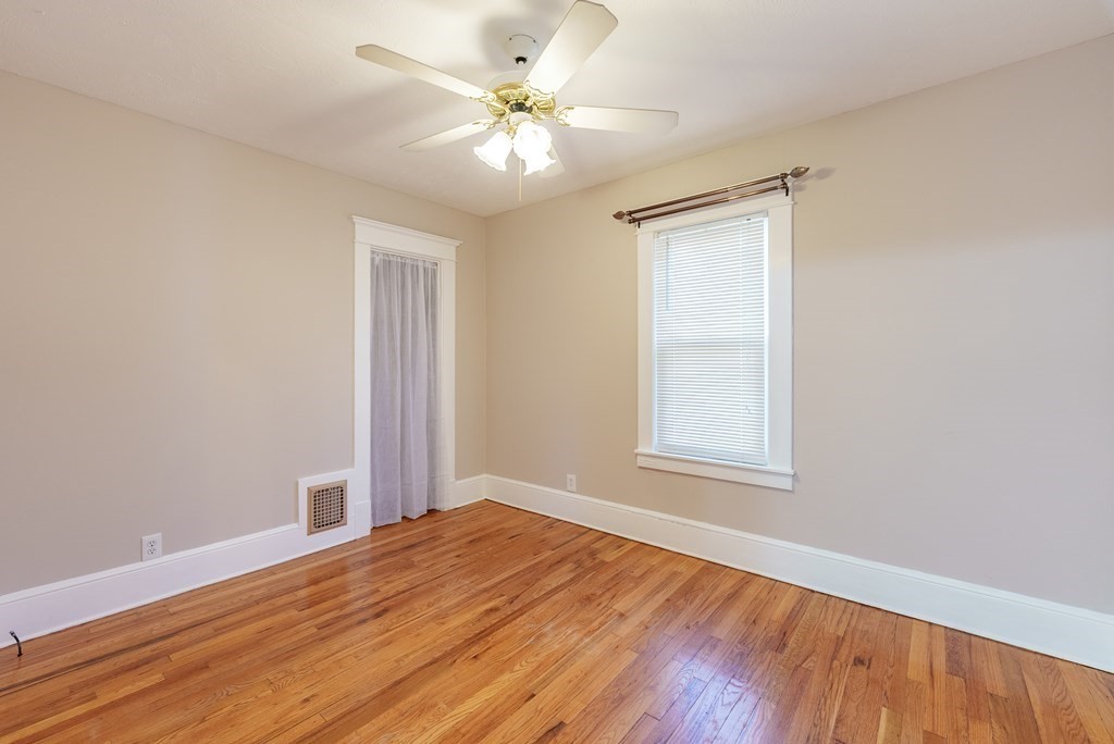 127 Webber Street Springfield, MA 01108 - Photo 19 of 33 an empty room with wooden floor and windows