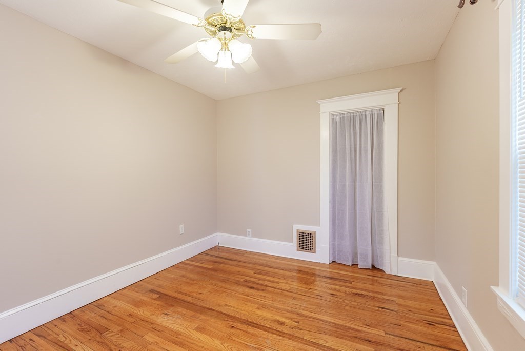 127 Webber Street Springfield, MA 01108 - Photo 20 of 33 a view of a room with wooden floor and a chandelier fan