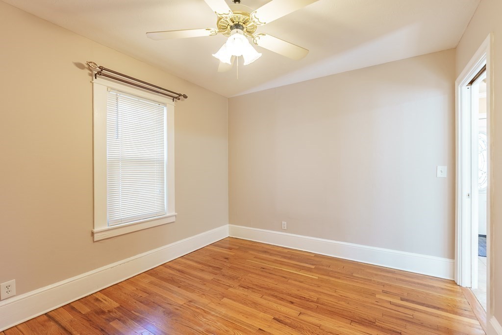127 Webber Street Springfield, MA 01108 - Photo 22 of 33 a view of an empty room with wooden floor and a window