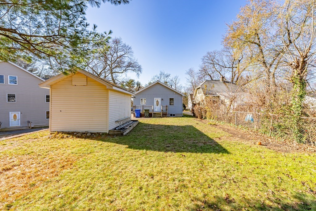 127 Webber Street Springfield, MA 01108 - Photo 29 of 33 a view of house with backyard and trees