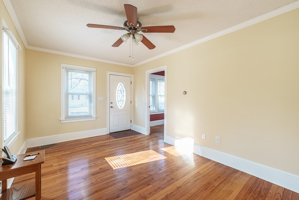 127 Webber Street Springfield, MA 01108 - Photo 5 of 33 a view of an empty room with window and wooden floor