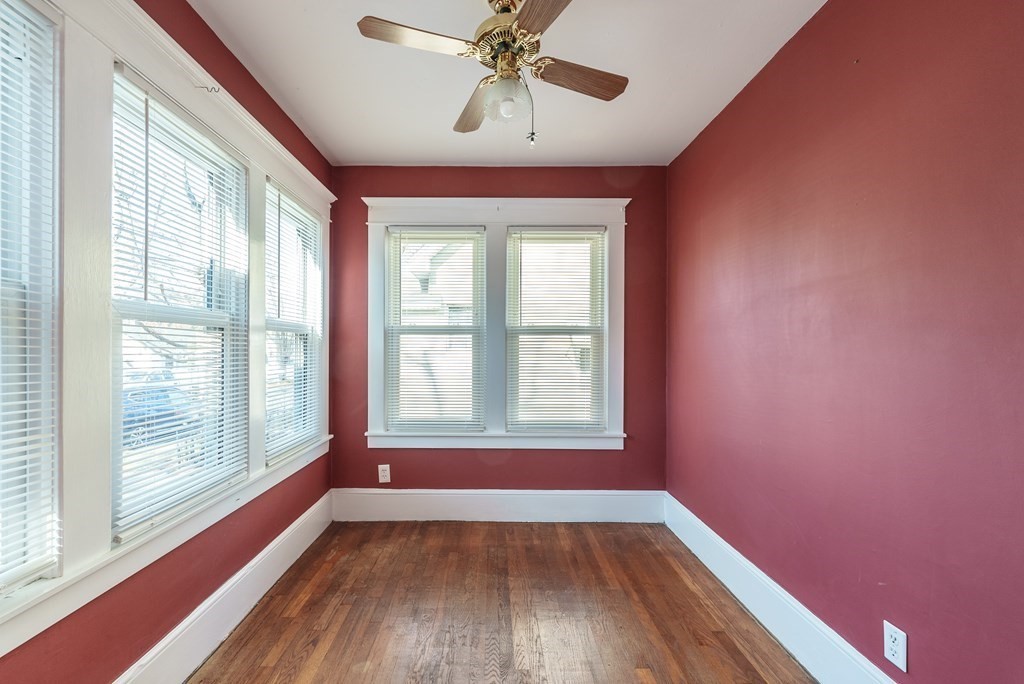 127 Webber Street Springfield, MA 01108 - Photo 6 of 33 a view of an empty room with a window and wooden floor