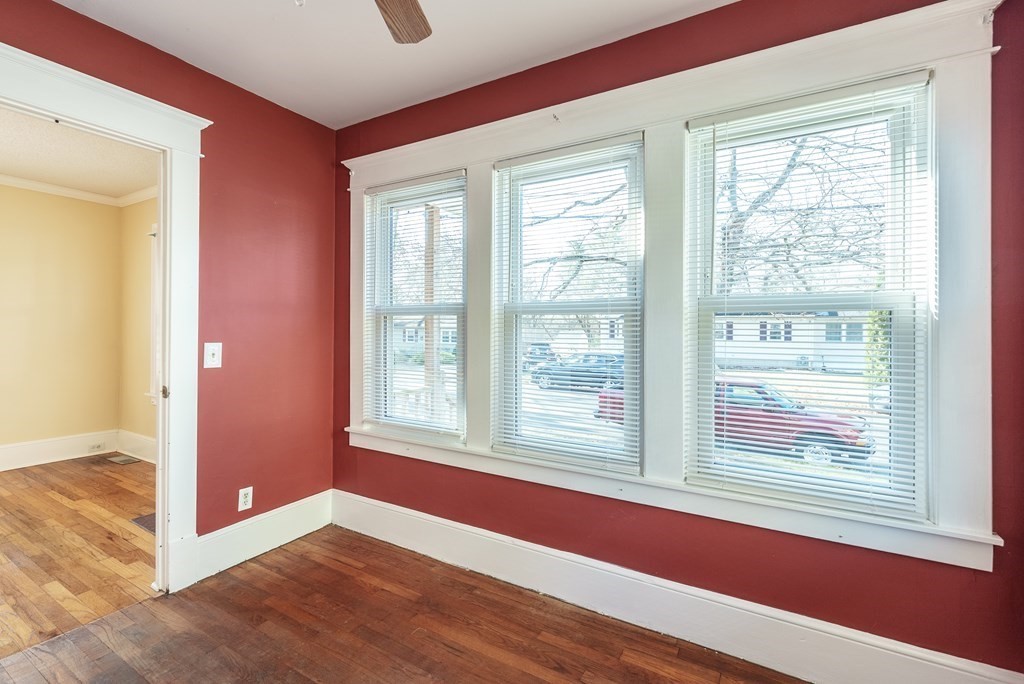 127 Webber Street Springfield, MA 01108 - Photo 7 of 33 an empty room with wooden floor and windows