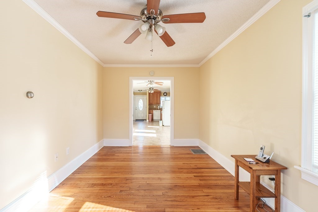 127 Webber Street Springfield, MA 01108 - Photo 8 of 33 a hallway with wooden floor chandelier and entryway