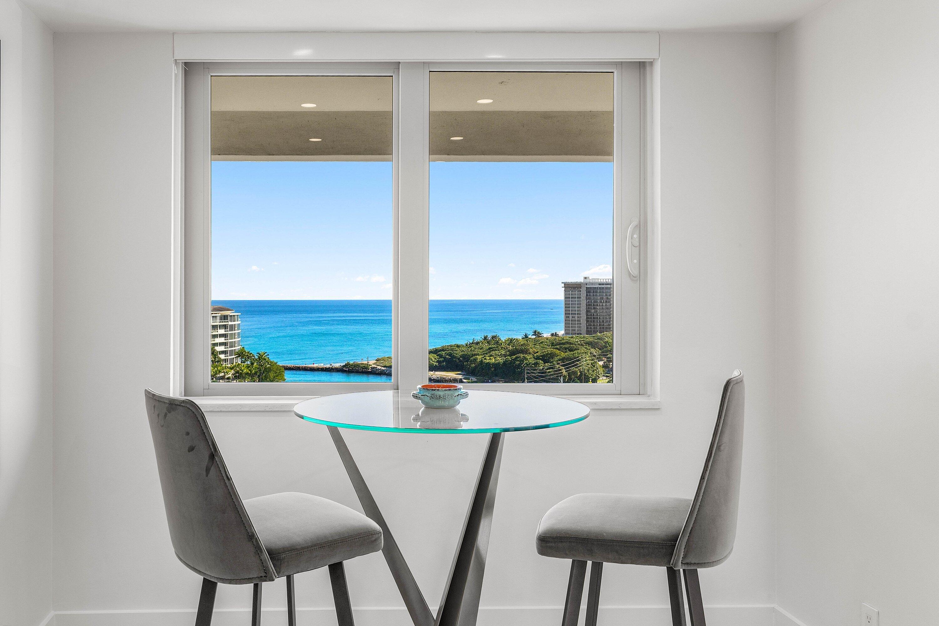 901 East Camino Real, Unit 15D Boca Raton, FL 33432 - Photo 16 of 42 a view of a dining room with furniture and a window