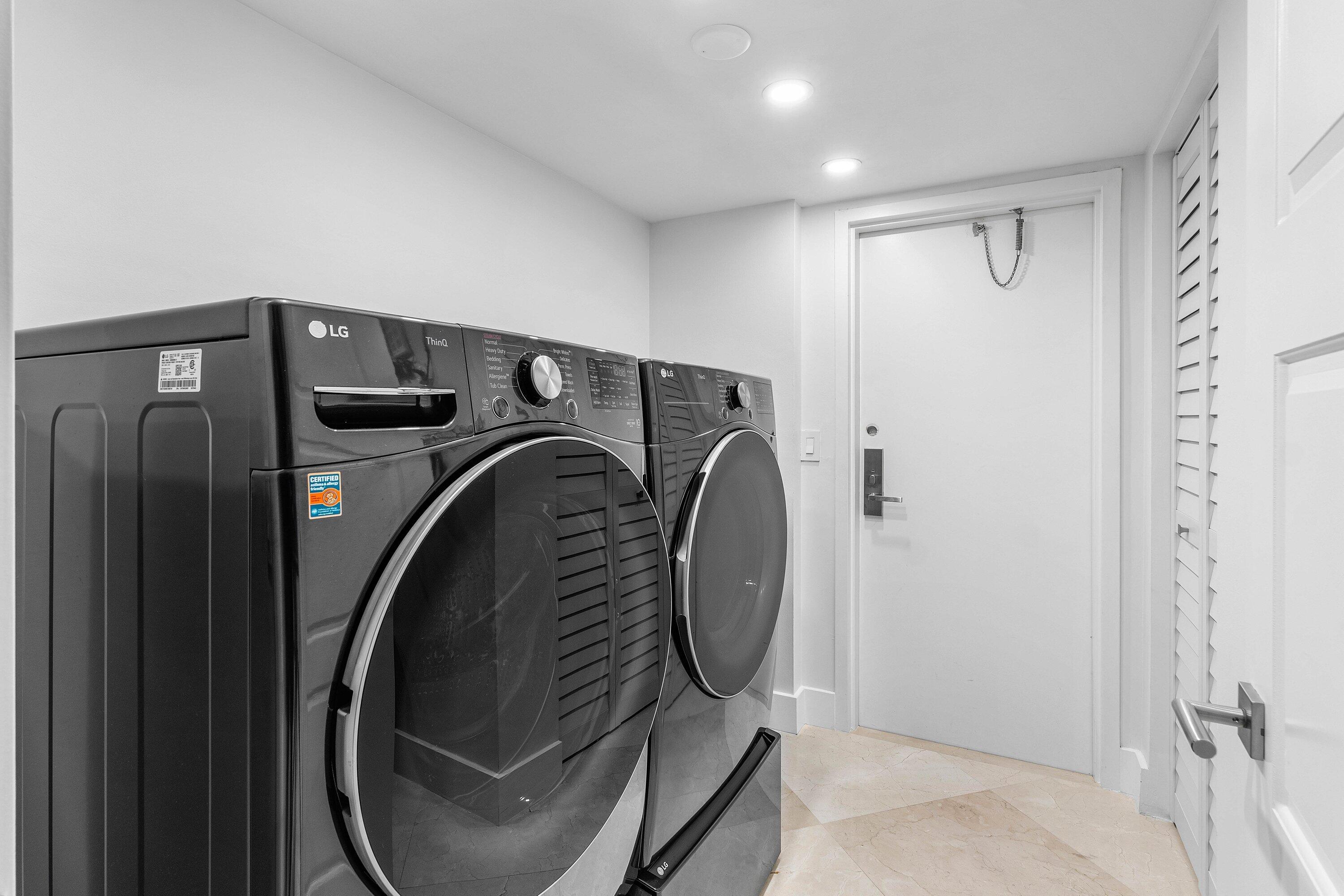 901 East Camino Real, Unit 15D Boca Raton, FL 33432 - Photo 18 of 42 a utility room with dryer and washer