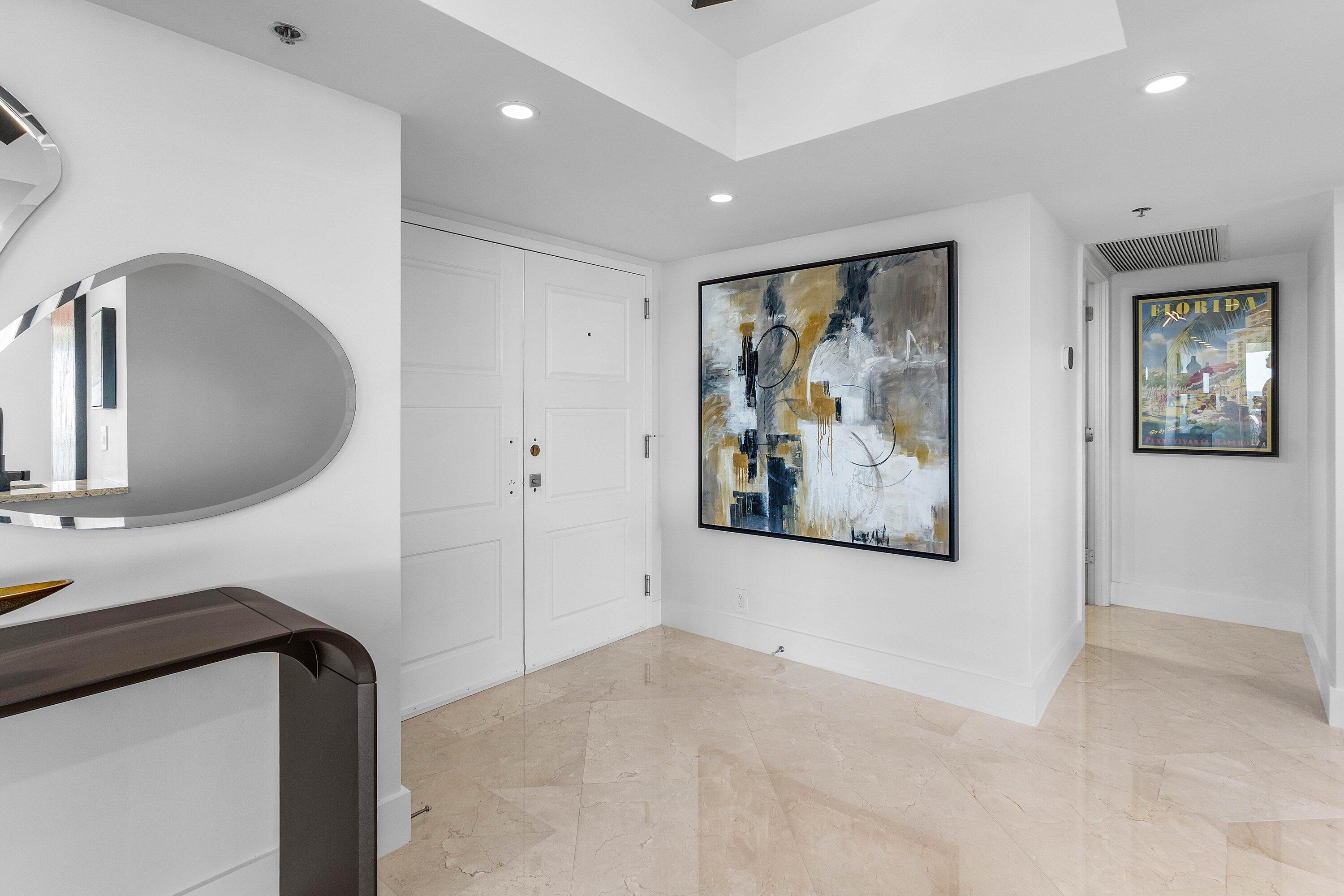 901 East Camino Real, Unit 15D Boca Raton, FL 33432 - Photo 2 of 42 a view of a hallway with entryway and window