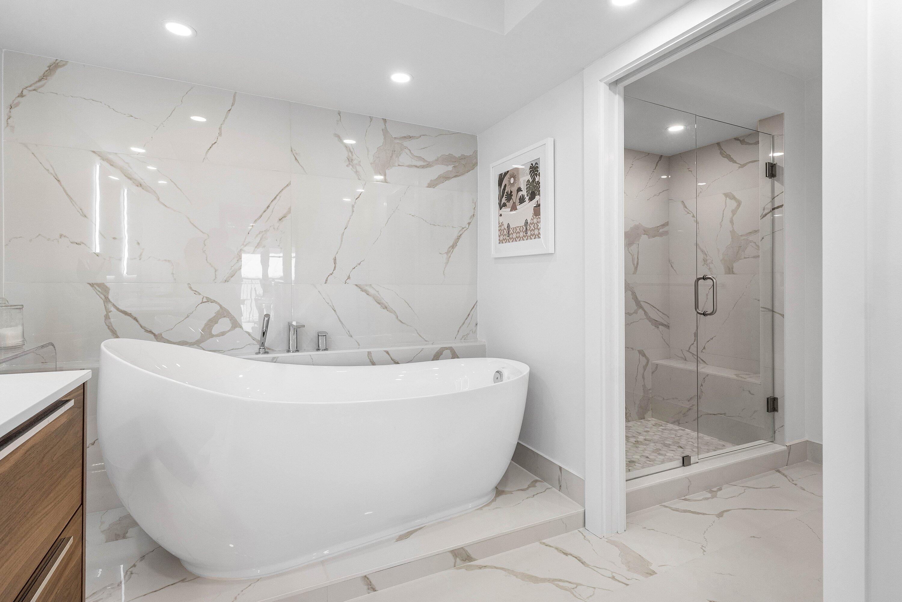 901 East Camino Real, Unit 15D Boca Raton, FL 33432 - Photo 29 of 42 a white bath tub sitting in a bathroom