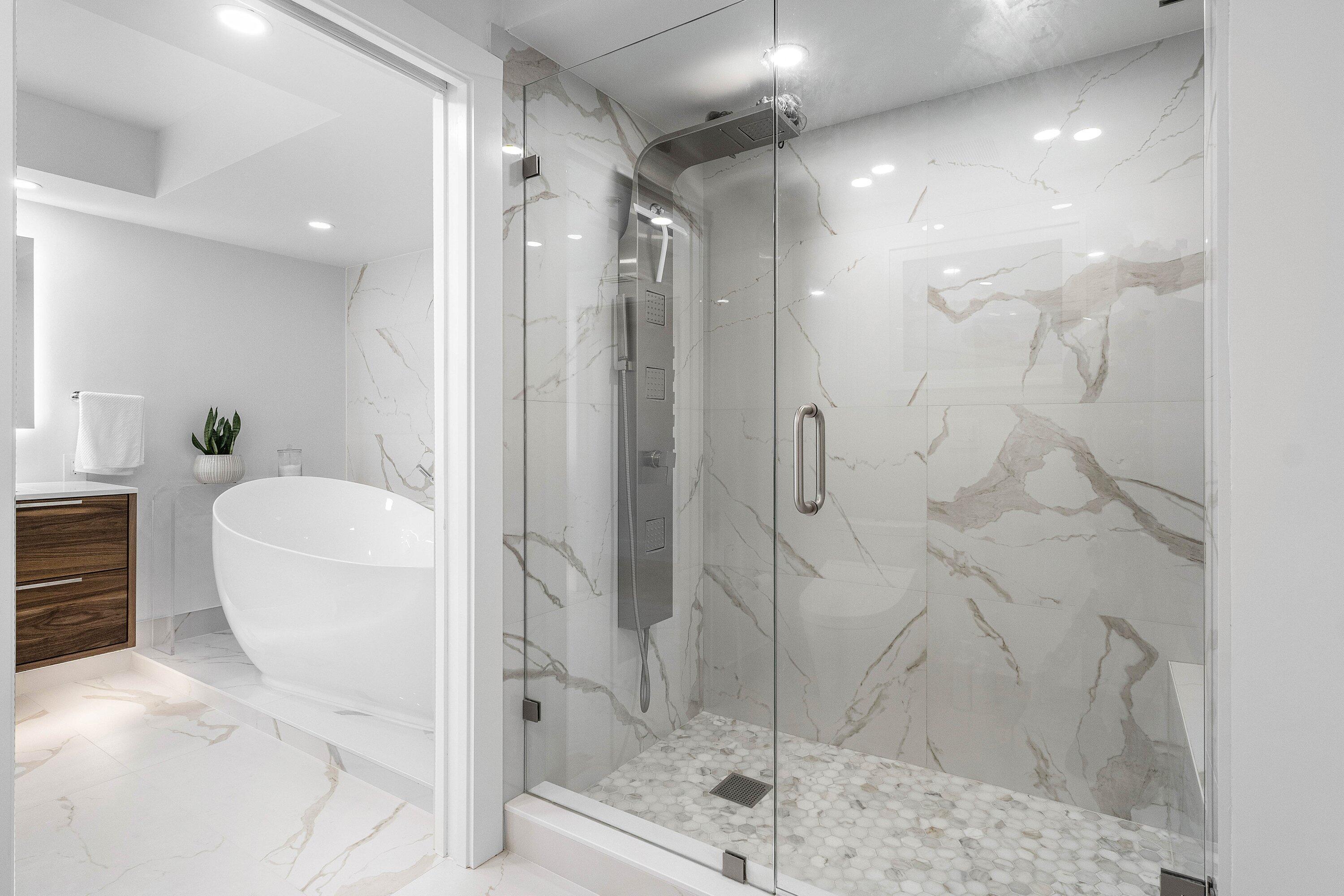 901 East Camino Real, Unit 15D Boca Raton, FL 33432 - Photo 30 of 42 a bathroom with a shower and a sink