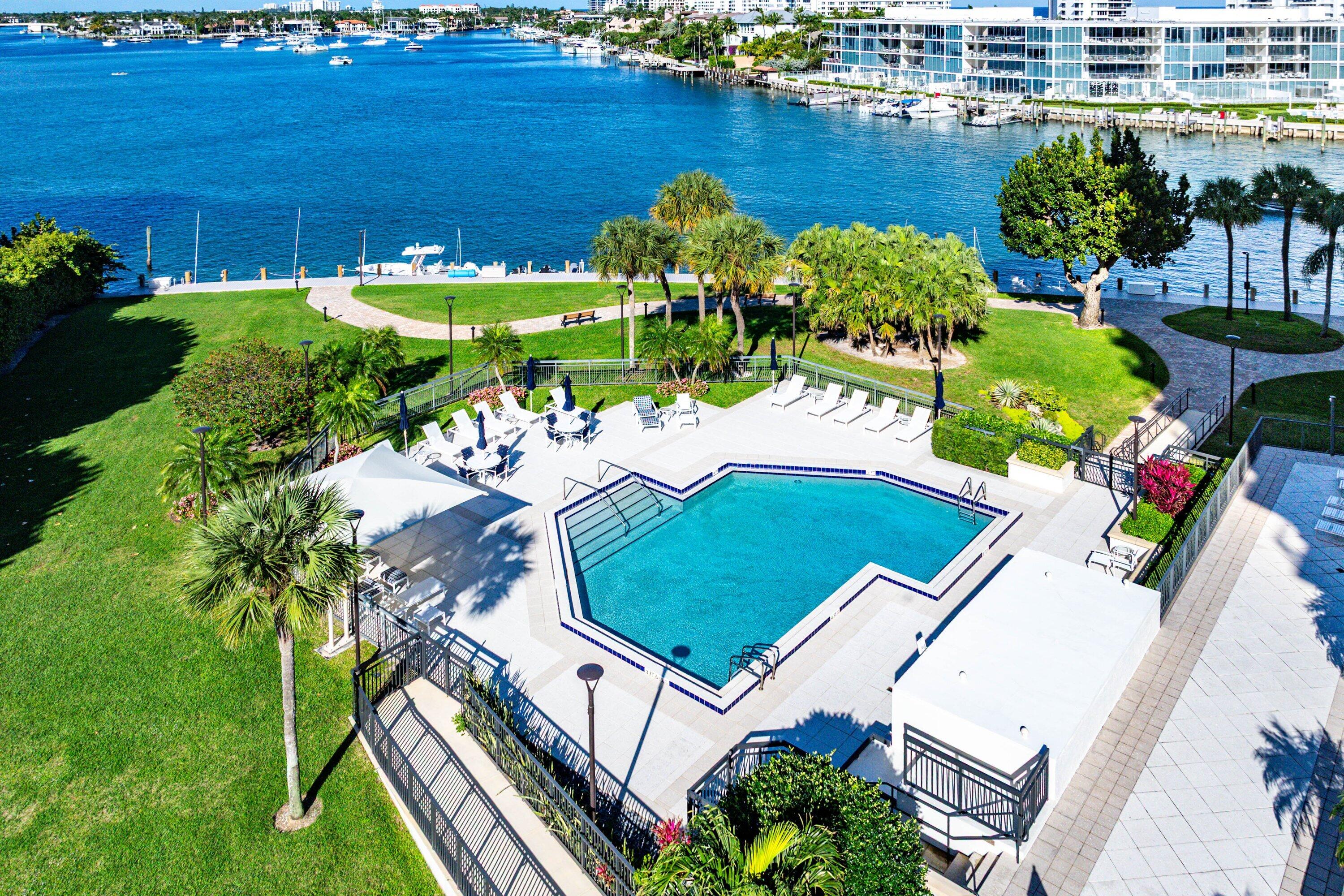 901 East Camino Real, Unit 15D Boca Raton, FL 33432 - Photo 37 of 42 a aerial view of a house with a garden and lake view