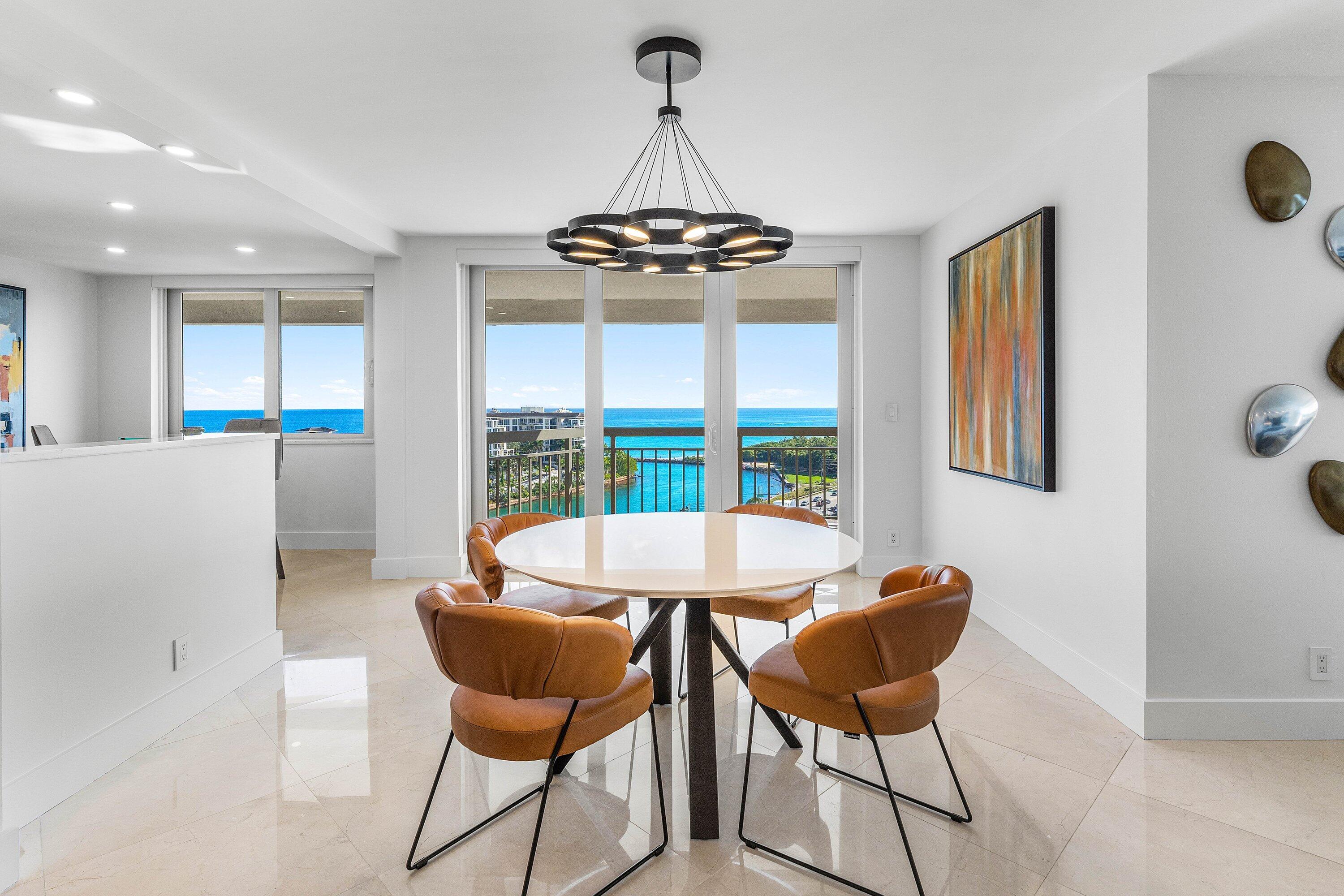 901 East Camino Real, Unit 15D Boca Raton, FL 33432 - Photo 6 of 42 a dining room with furniture and window