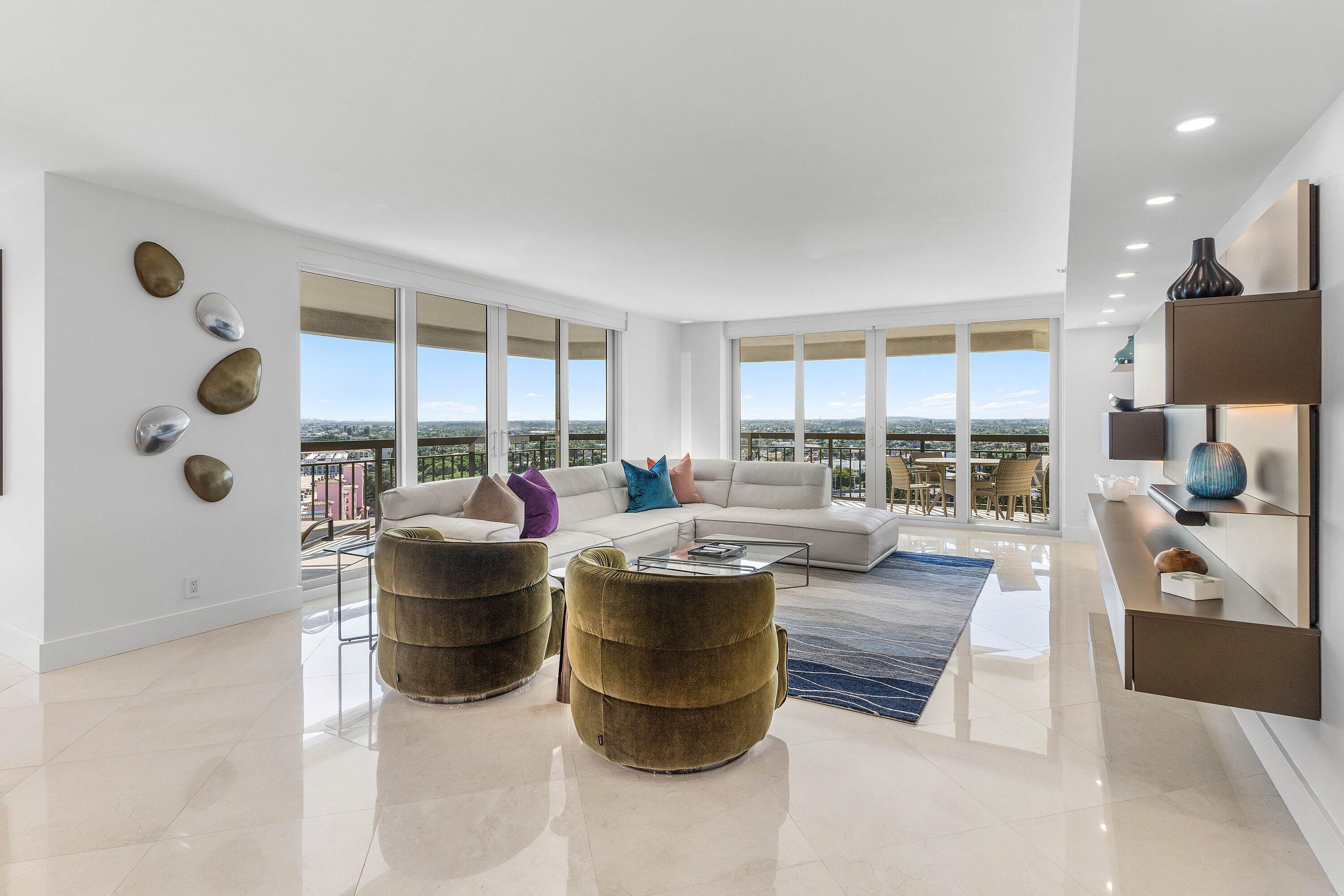 901 East Camino Real, Unit 15D Boca Raton, FL 33432 - Photo 7 of 42 a living room with couches and a large window with garden view