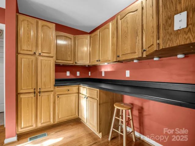 a view of a door with wooden floor