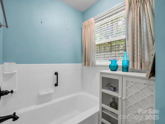 a bathroom with a bathtub and sink