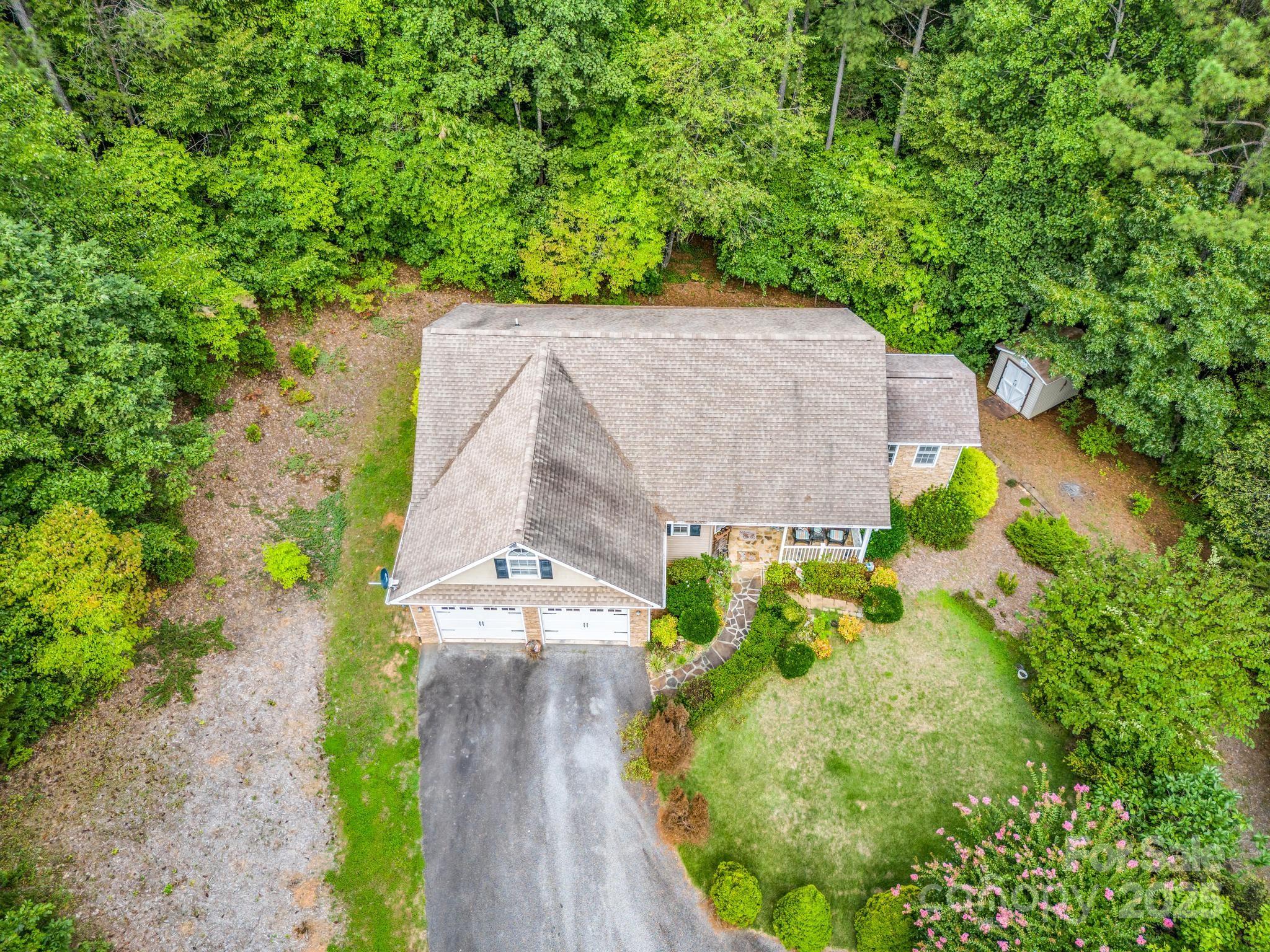 940 Hugh Champion Road Tryon, NC 28782 - Photo 33 of 36 a view of a garden with a pathway