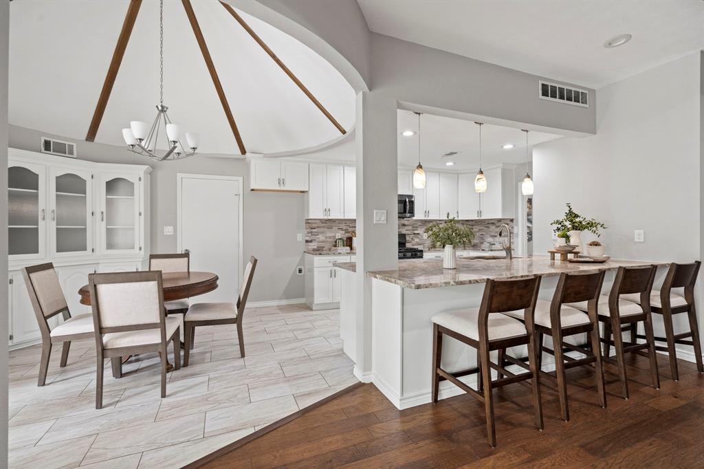 6349 Highgate Lane Dallas, TX 75214 - Photo 11 of 38 a view of a dining room with furniture and wooden floor