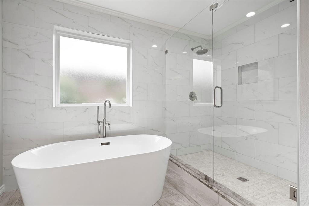 6349 Highgate Lane Dallas, TX 75214 - Photo 26 of 38 a white bath tub sitting next to a shower