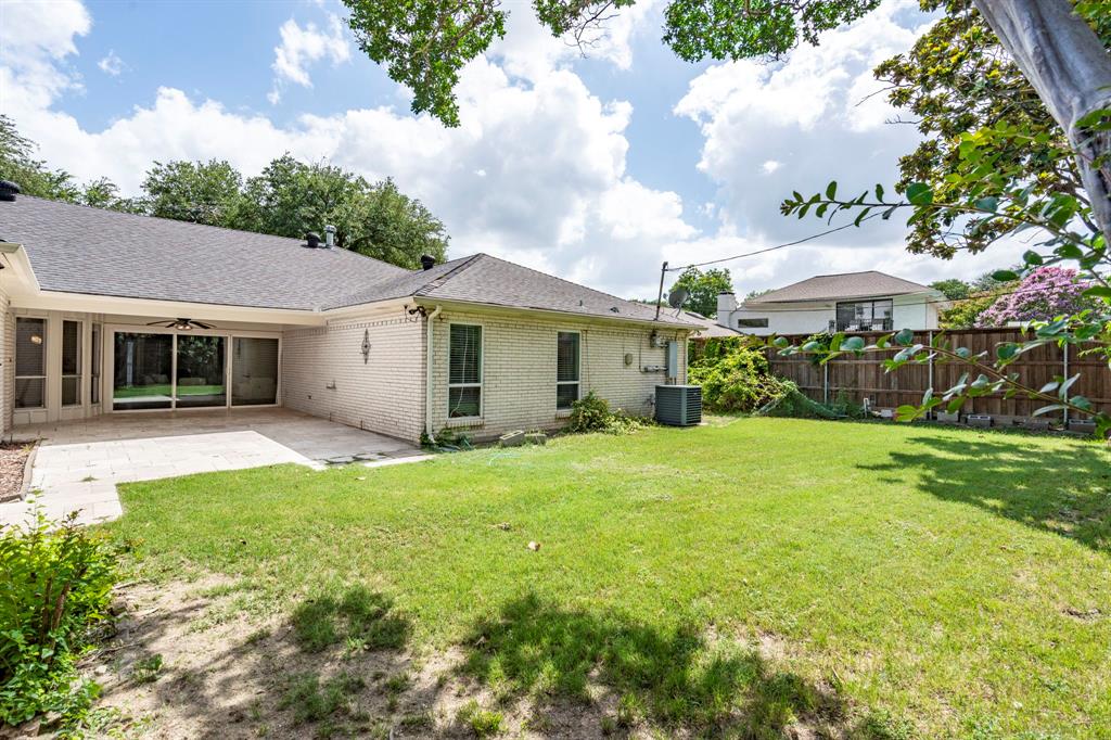 6349 Highgate Lane Dallas, TX 75214 - Photo 36 of 38 a view of a house with backyard and garden