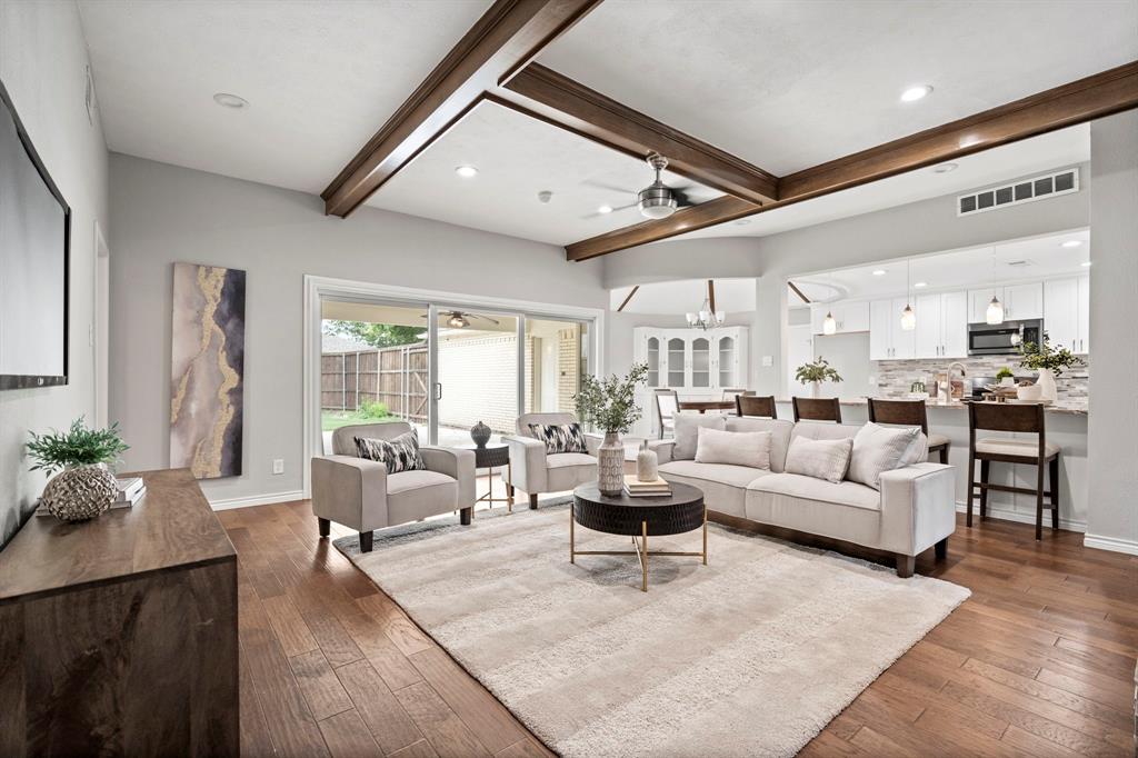6349 Highgate Lane Dallas, TX 75214 - Photo 5 of 38 a living room with furniture kitchen view and a large window