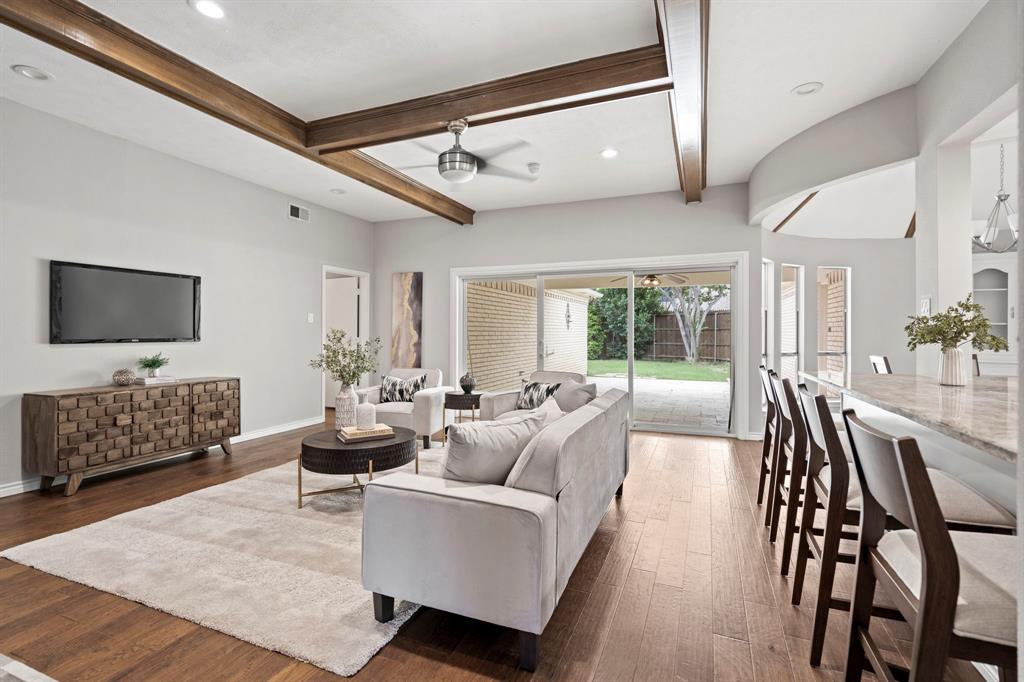 6349 Highgate Lane Dallas, TX 75214 - Photo 7 of 38 a living room with furniture and a flat screen tv