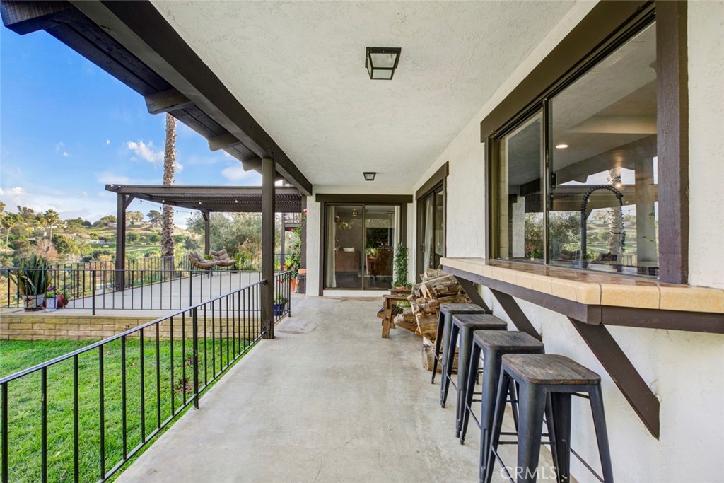 2527 Olive Hill Lane Fallbrook, CA 92028 - Photo 15 of 65 a view of a house with backyard and porch
