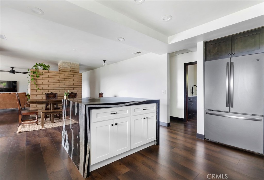 2527 Olive Hill Lane Fallbrook, CA 92028 - Photo 18 of 65 a kitchen with stainless steel appliances granite countertop a refrigerator and a stove top oven