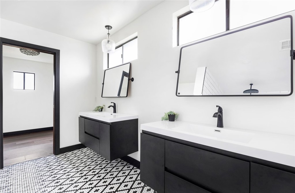 2527 Olive Hill Lane Fallbrook, CA 92028 - Photo 29 of 65 a bathroom with a sink and a mirror