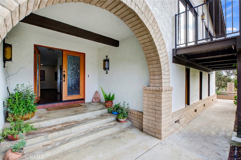 2527 Olive Hill Lane Fallbrook, CA 92028 - Photo 3 of 65 a front view of a house with a garden