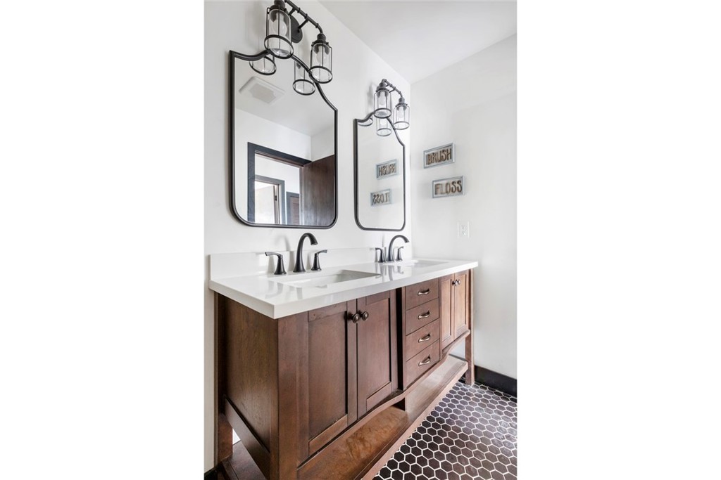2527 Olive Hill Lane Fallbrook, CA 92028 - Photo 36 of 65 a bathroom with a sink and a mirror