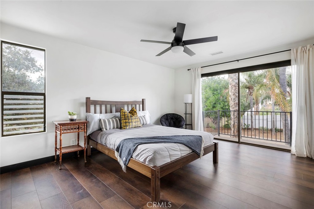 2527 Olive Hill Lane Fallbrook, CA 92028 - Photo 37 of 65 a bedroom with a bed and a large window