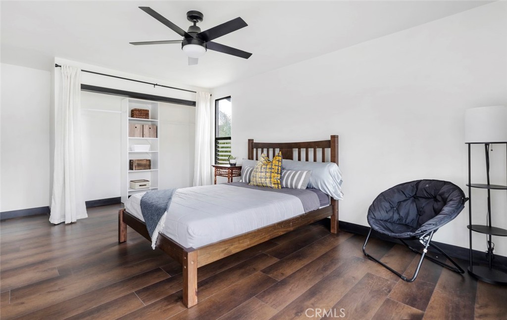 2527 Olive Hill Lane Fallbrook, CA 92028 - Photo 38 of 65 a bed room with a bed and a chandelier