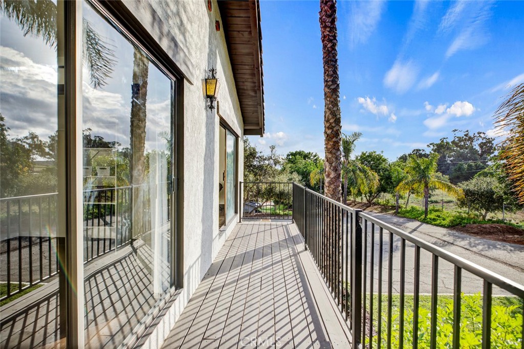 2527 Olive Hill Lane Fallbrook, CA 92028 - Photo 39 of 65 a view of a balcony with wooden floor and wooden fence