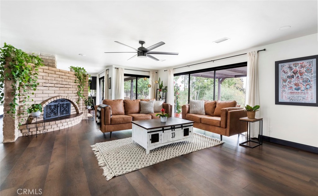 2527 Olive Hill Lane Fallbrook, CA 92028 - Photo 5 of 65 a living room with furniture and a fireplace