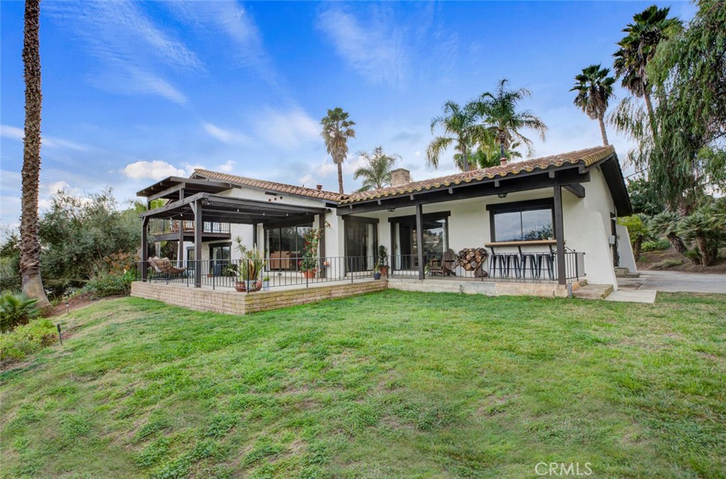 2527 Olive Hill Lane Fallbrook, CA 92028 - Photo 51 of 65 a view of a house with a yard porch and sitting area