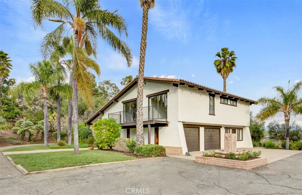 2527 Olive Hill Lane Fallbrook, CA 92028 - Photo 52 of 65 a front view of a house with a garden