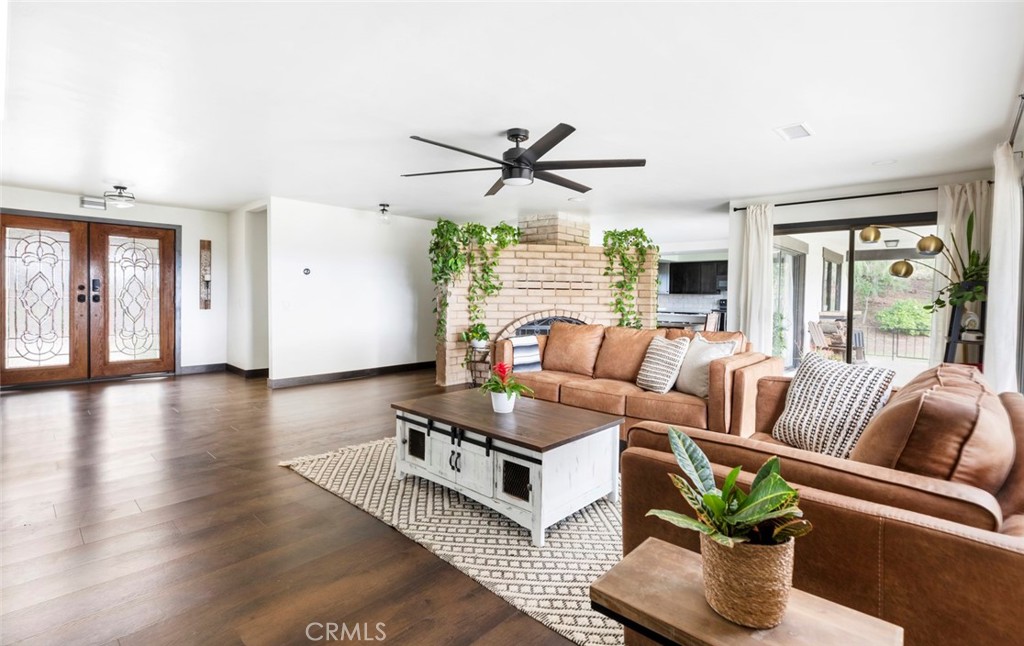 2527 Olive Hill Lane Fallbrook, CA 92028 - Photo 6 of 65 a living room with furniture and wooden floor