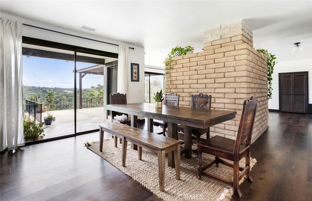 2527 Olive Hill Lane Fallbrook, CA 92028 - Photo 10 of 65 a view of a dining room with furniture window and wooden floor