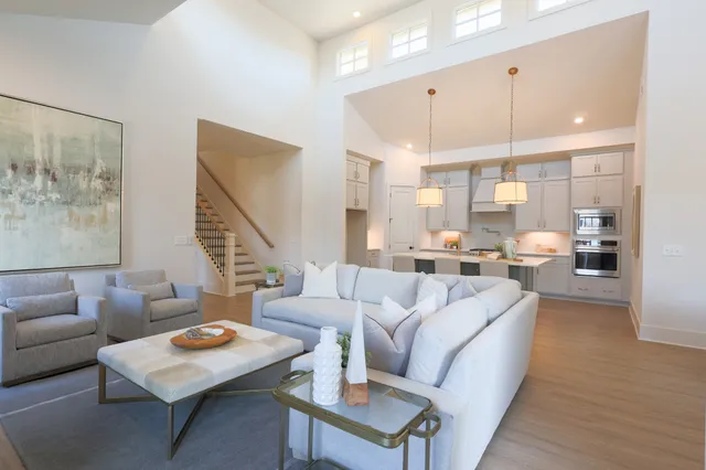 a living room with furniture and a table