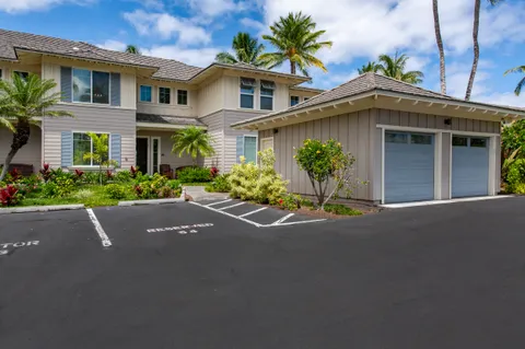 front view of a house with a garden