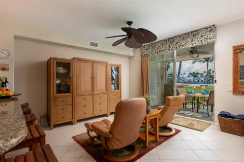 a view of a livingroom with furniture and a window