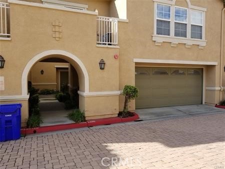 a front view of a house with garage