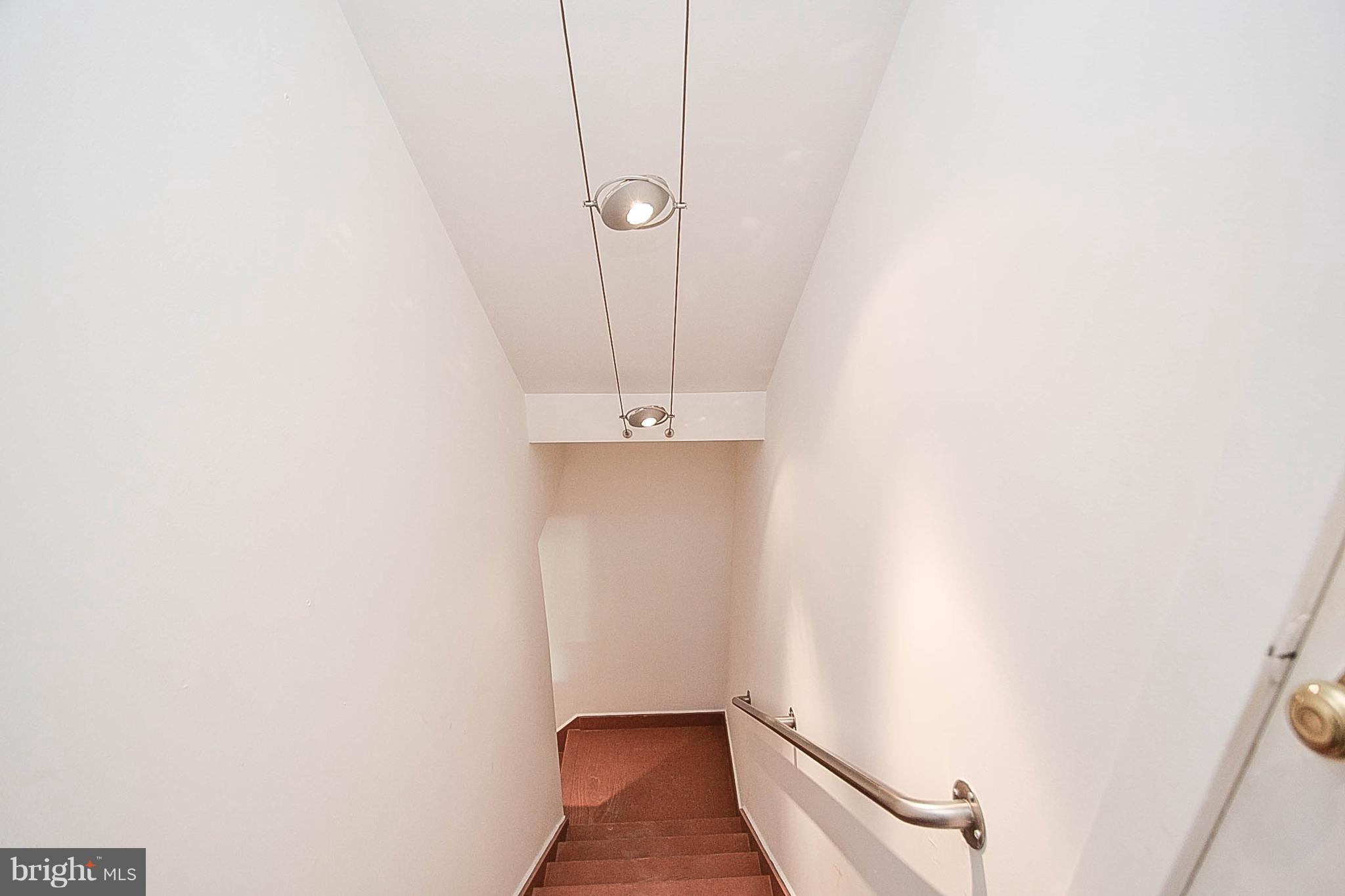 21129 Reno Monument Road Boonsboro, MD 21713 - Photo 18 of 32 a view of a room with wooden floor and white walls
