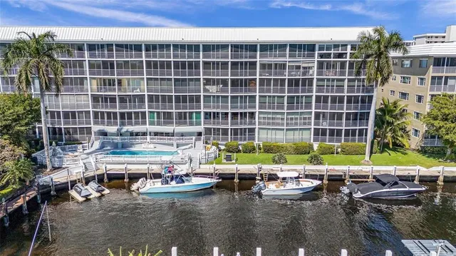 a view of swimming pool with outdoor seating